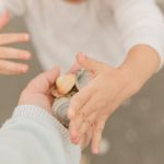 21monthold-toddler-girl-collection-seashells-on-the-sandy-seashore-of-picture-id1297106433