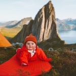 baby-on-camping-mat-in-mountains-family-vacations-adventure-healthy-picture-id1278454210